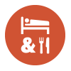 White bed, ampersand symbol, and fork and knive icon on orange circle background