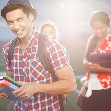 Stock photo of a student smiling at the camera