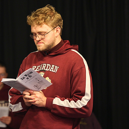 SCC PACE student reading the The Wizard of Oz script 