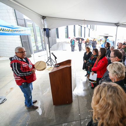 SFCC Indigenous Outreach and Support Manager and Coeur D’Alene Tribe MemberMark Ramos (right) performing a traditional song at the grand opening of SFCC