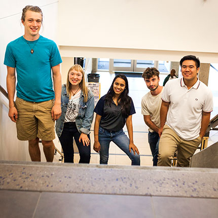 A group of students walking up stairs