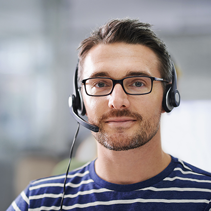 Customer service representative wearing a telephone headset