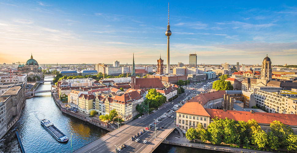 Aerial view of Berlin skyline with famous TV tower and Spree river in beautiful evening light at sunset, Germany.