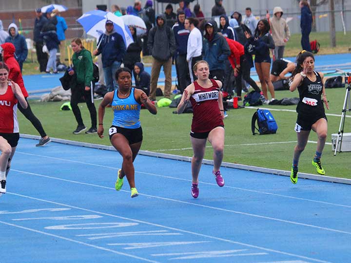 Women's track and field sprinting with the competition