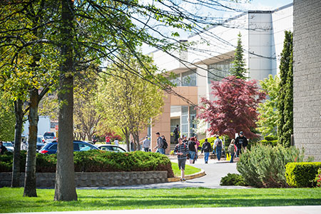 Students walking to building 1 in Spring time