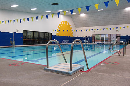 Indoor shot of the SCC pool with banners hung above the water